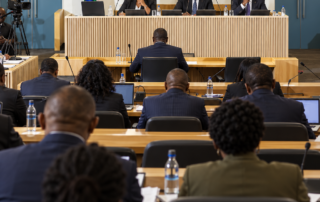 AI-generated illustration inspired by the Madlanga Commission hearing room, showing a panel, witness and seated legal teams.